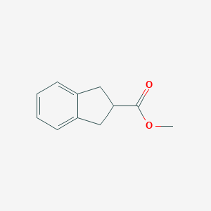 2-Methoxycarbonyl-indane