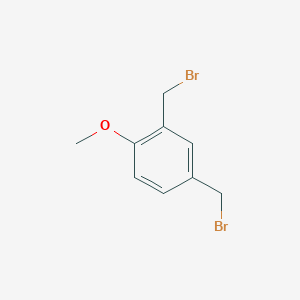 Benzene, 2,4-bis(bromomethyl)-1-methoxy- 